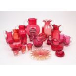 A quantity of Victorian and later cranberry glass, to include ten jugs, the tallest 21cm high,