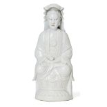 A Chinese Dehua porcelain figure of Guanyin, 19th century, seated in dhyanasana on a lotus base,