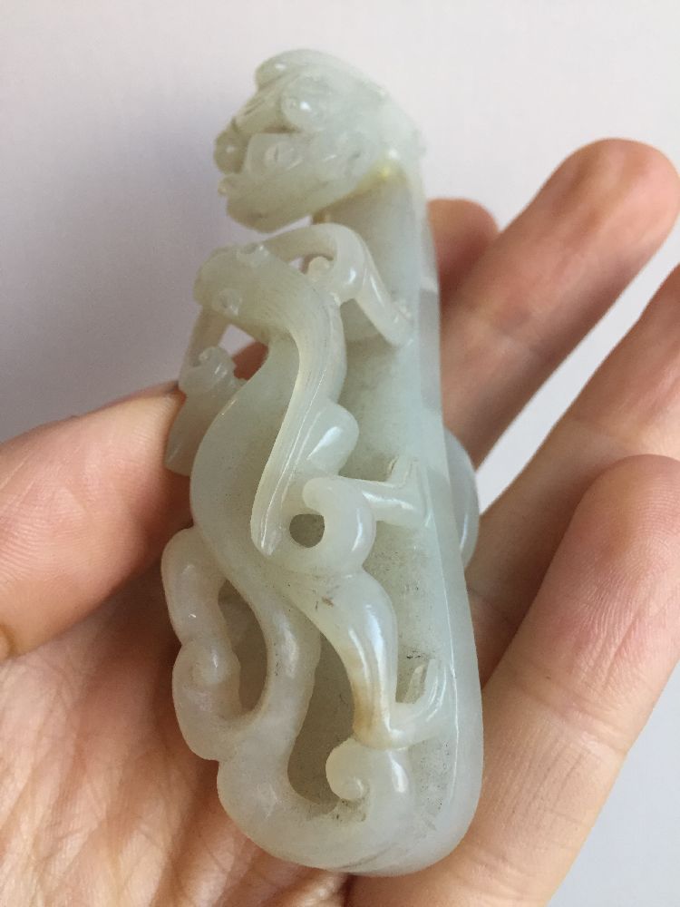 A Chinese pale green jade dragon belt hook, 18th century, carved with a dragon head terminal and a - Image 8 of 11