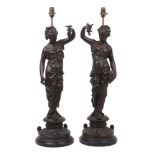 A pair of French spelter figural lamps, late 19th century, modelled as female bacchante, 70cm