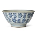A large Chinese porcelain provincial bowl, early 19th century, painted in underglaze blue to the