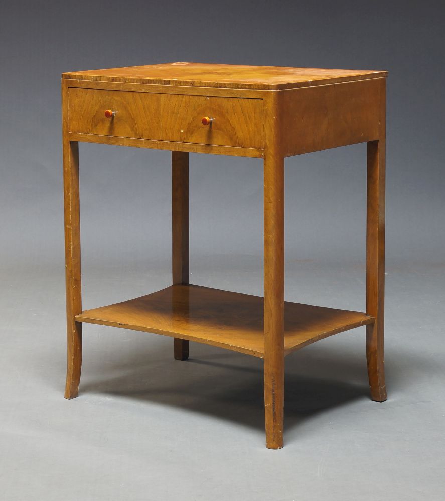 An Art Deco walnut side table, c.1930, the rectangular quarter veneered top above two frieze drawers