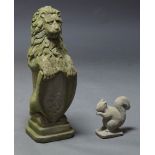 A reconstituted stone shield baring lion, 20th century, 80cm high together with a reconstituted