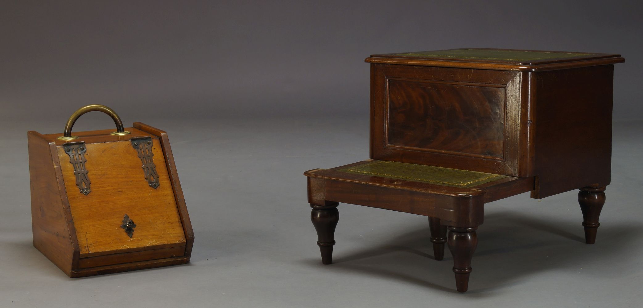 A Victorian set of mahogany bed steps, each step inset with green leather, raised on turned and