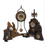 A group of seven spelter and brass mantle clocks and timepieces, 20th century, comprising: a