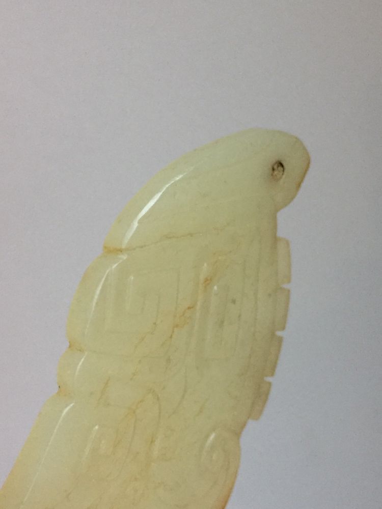 A rare Chinese yellow jade pendant, Western Zhou dynasty, carved as a stylised mythical beast with a - Image 3 of 11
