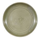 A Chinese Longquan celadon dish, Ming dynasty, 15th/16th century, covered in a thick olive glaze and