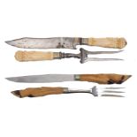 A German ivory and steel carving knife and fork set, late 19th century, the knife blade stamped Karl