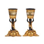 Two figural gilt resin candle holders, late 20th century, each modelled as a crouching boy, on