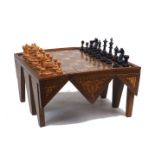 A Near Eastern abalone shell inlaid hardwood folding chess table, late 20th century, together with