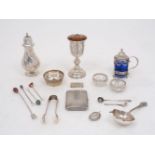 A small group of silver and white metal items comprising: a tea strainer and stand, Birmingham, c.