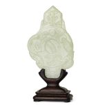 A Chinese pale green jade plaque, 20th century, the disc plaque carved in low relief with a