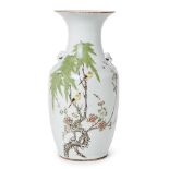 A Chinese porcelain baluster vase, Republic period, painted in famille rose enamels with a pair of