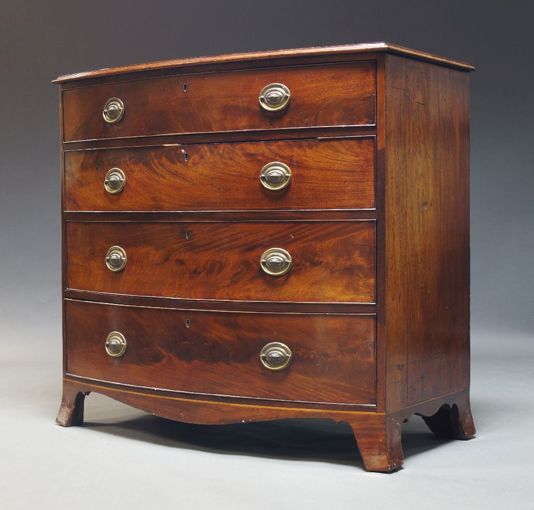 A Regency mahogany bowfront chest, with four long graduated drawers, on splayed bracket feet,