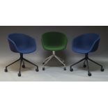 Hay, Three 'AAC 24' swivel chairs, of recent manufacture, two with blue upholstered seats, on