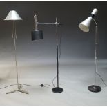A chromed and brushed steel floor lamp, c.1960, with double cone shade on adjustable stand with