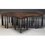 A set of stained oak tables, of recent manufacture, the triangular oak tops on square section