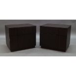 A pair of contemporary side cabinets, of recent manufacture, each with two sprung drawers, raised on