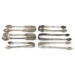 Six pairs of Georgian silver sugar tongs, comprising a William IV pair attractively decorated with