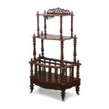 A Victorian walnut Canterbury whatnot, with three serpentine tiers on spiral turned supports, the