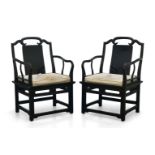 A pair of Chinese black lacquered armchairs, late 20th century, the shaped open backs with