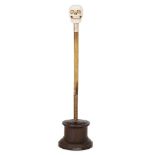 Property of a Gentleman A gold mounted rhinoceros horn riding crop section with carved ivory skull