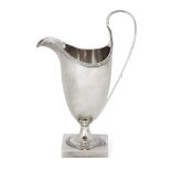 A George III silver helmet-shaped cream jug by Hester Bateman, London, c.1787, designed with an