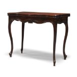 A George III mahogany card table, in the French Hepplewhite style, the fold over top enclosing green