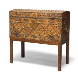 An Iberian brass studded and leather trunk on later stand, first half 20th century, in brown leather