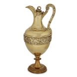 A gilded Victorian silver claret jug by Stephen Smith, London, c.1881, the bulbous body with a