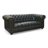 A large green leather button back chesterfield sofa, late 20th century, with steel stud