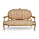 A Louis XVI style giltwood canape, second half 20th century, the oval backrest centred by folded