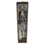 Property of a Gentleman A white metal (tests as silver) miniature articulated skeleton, early 20th