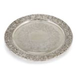 A decorative silver serving plate, London, c.1920, Mappin & Webb, the pierced rim richly decorated