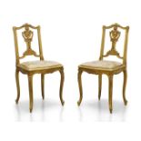 A pair of Louis XV style giltwood salon chairs, early to mid 20th century, the open backrests