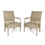 A pair of Louis XVI white painted fauteuils, with rectangular backs, upholstered in beige fabric, on