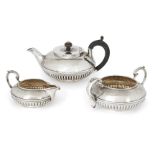 A matched George IV three-piece silver tea set, London, c.1826, (teapot) and London, c. 1839,