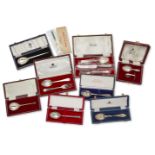 A group of cased silver christening sets of flatware including: an Asprey & Co. silver fork and