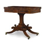 A Regency rosewood and inlaid card table, the fold over top with scrolling foliate marquetry band