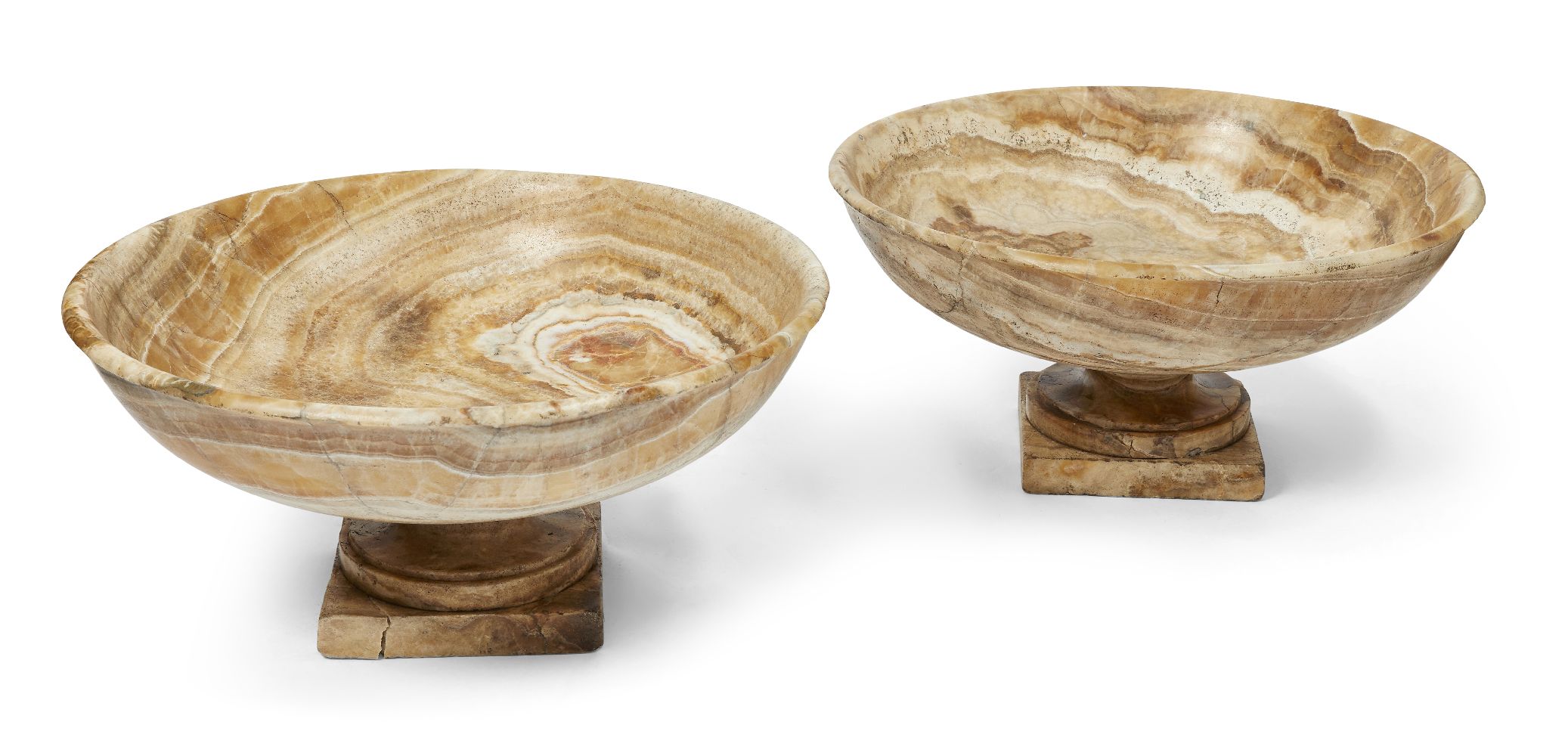 A pair of Italian alabastro fiorito tazze, 20th century, on square-section bases, 25cm high, 51cm