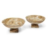 A pair of Italian alabastro fiorito tazze, 20th century, on square-section bases, 25cm high, 51cm