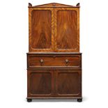 A Regency mahogany secretaire cabinet, the top surmount with arched pediment centred by turned