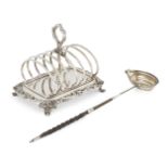 A Victorian silver toast rack, London, c.1840, Robert Hennell III, the six divisions centred by a