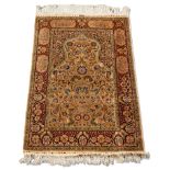 A Hereke silk prayer rug, mid to late 20th century, the Mihrab field with all over floral and