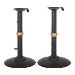 A pair of sheet iron and brass mounted 'Wedding Band' hog scrapper candlesticks, each with flared