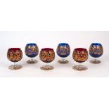 Six opaque and clear glass goblets, 20th Century, three in blue glass and three in red glass, each