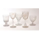 A group of five large engraved stemmed glasses, 19th century, various shapes and decoration, to
