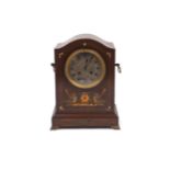 A French mahogany cased mantle clock, late 19th Century, the case of rectangular form with bow roof,