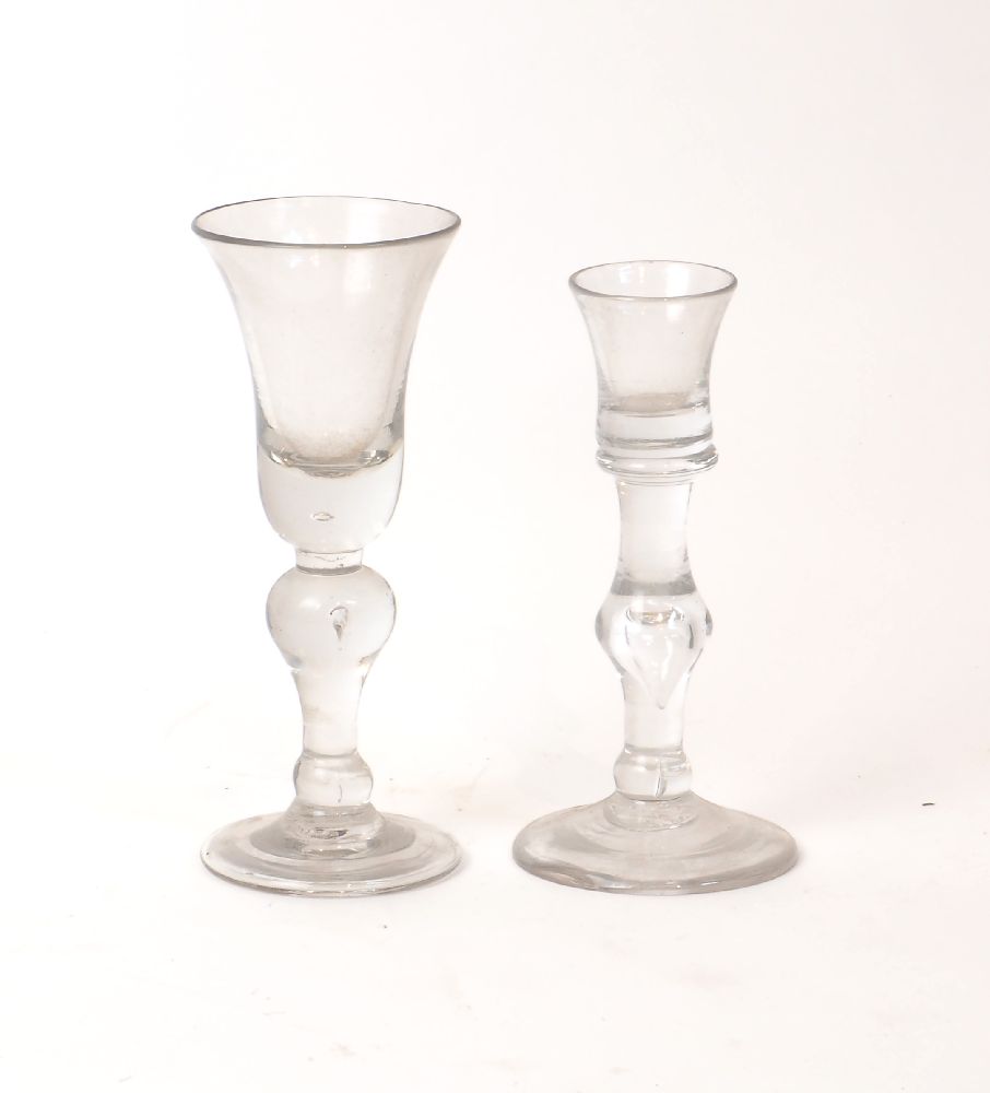 A George II cordial glass, c.1730, with baluster tear drop stem, 15.2cm high; together with a George