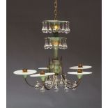 A five light chandelier, mid 20th Century, in green patinated finish, with brass arms and glass